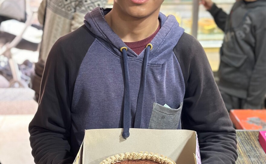 Maher Al Faraa, 18, bought a chocolate cake from Batool Cakes to surprise his aunt for her birthday, in Rafah, Gaza. "We wanted to make her happy because of the war and her bad mood, all of our moods," he says.