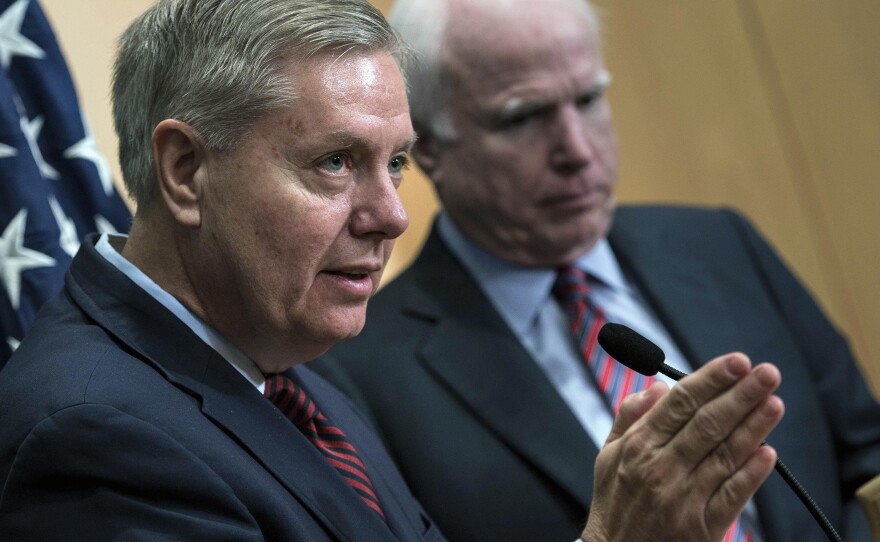 Senators Lindsey Graham and John McCain say President Obama's total withdrawal of U.S. troops from Iraq is to blame for the surge in violence for al-Qaida there.