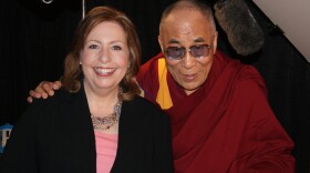 KPBS Midday Edition host Maureen Cavanaugh poses with the Dalai Lama during a KPBS exclusive interview at San Diego State University on April 19, 2012.