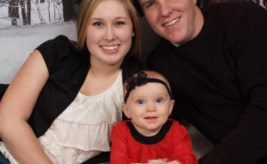 Staff Sgt. Robert Thomas with wife Kristina and daughter Hailey.