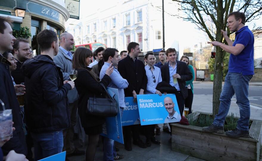 Conservative party Chairman Grant Shapps speaks to party supporters after canvassing in London on Saturday.