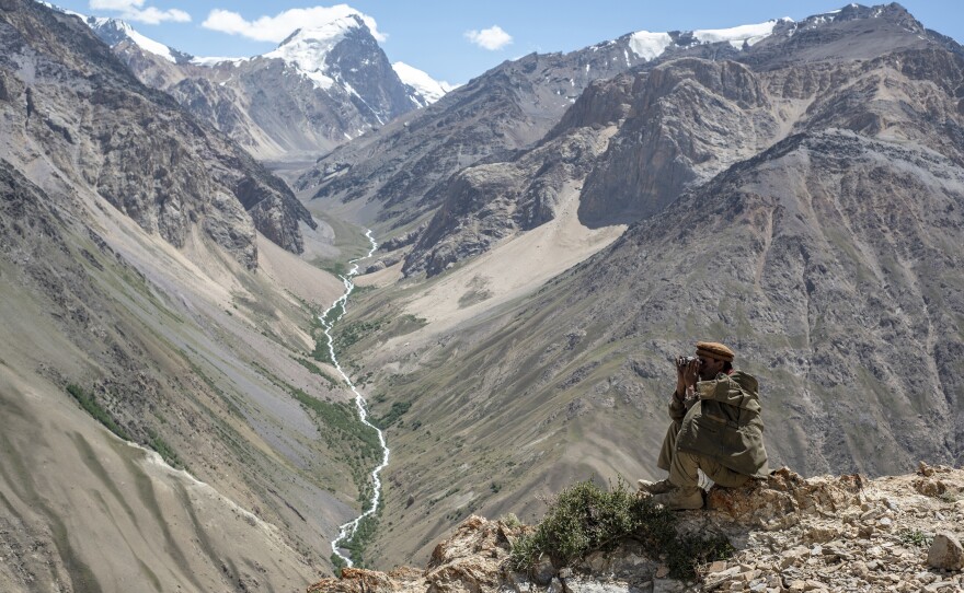 A Wakhi man looks out at the mountains in the Wakhan corridor of Afghanistan. Uyghurs leaving China have trekked through the region. Now many Uyghurs in Afghanistan fear the Taliban could deport them to China.