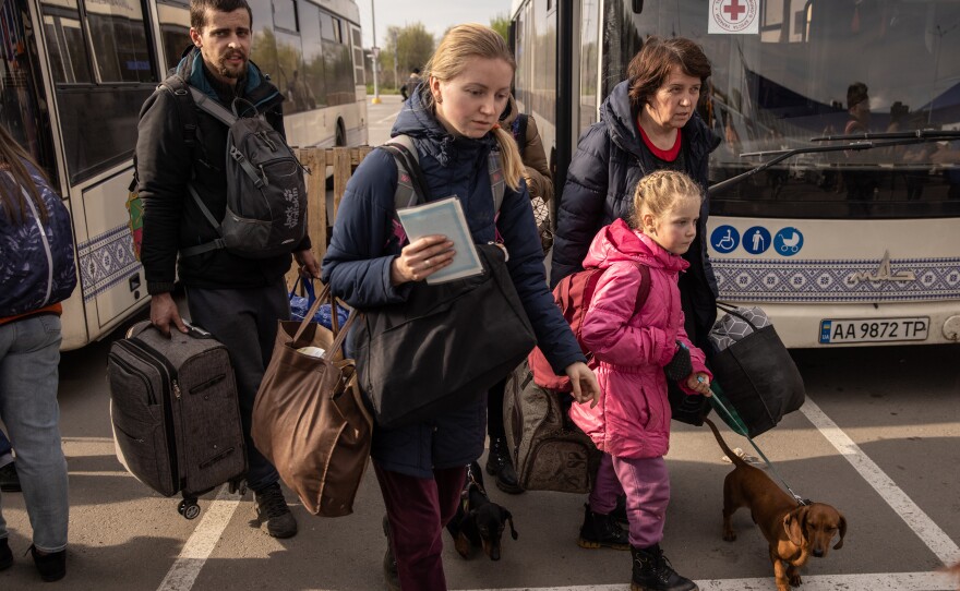 Evacuees from Mariupol arrive in Zaporizhzhia on Tuesday.