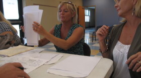 Twin sisters Sheila Newman (left) and Sheryl Lindsay of Orange Beach, Ala., make their case to a BP claims adjuster. The wedding planners have been trying since June to get BP to pay for lost income from the oil spill.