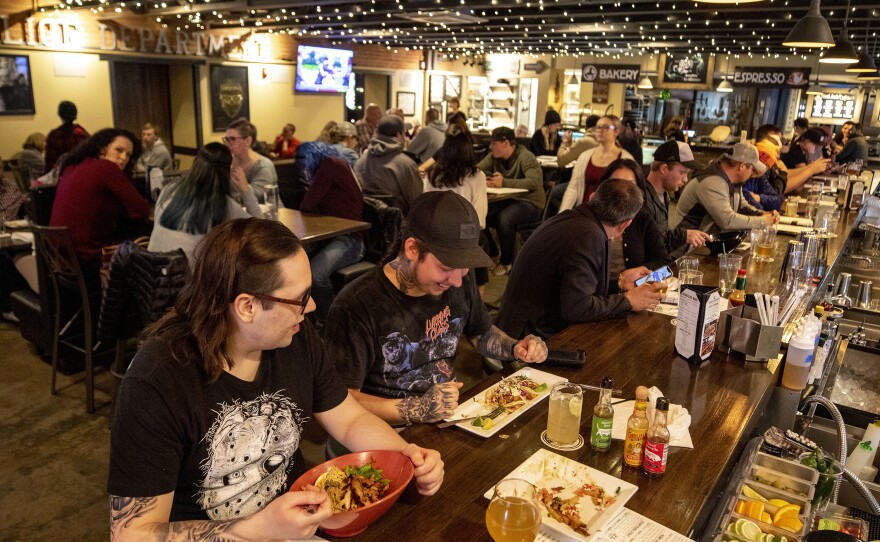 Connor Moore and Matt Gallegos, who grew up in Pueblo, sit at the end of the bar inside Brues Alehouse Brewing Company.