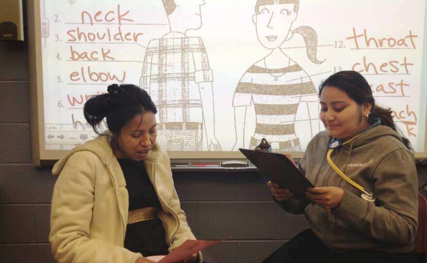 Students participate in a health literacy class at Mary's Center, role-playing a visit to the doctor.