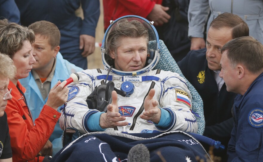 Russian cosmonaut Gennady Padalka gestures after landing near the town of Dzhezkazgan (Zhezkazgan), Kazakhstan, on Saturday.