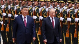 Russian President Vladimir Putin, right, and Chinese President Xi Jinping inspect an honor guard during a welcoming ceremony at the Great Hall of the People in Beijing Wednesday, May 20, 2026.