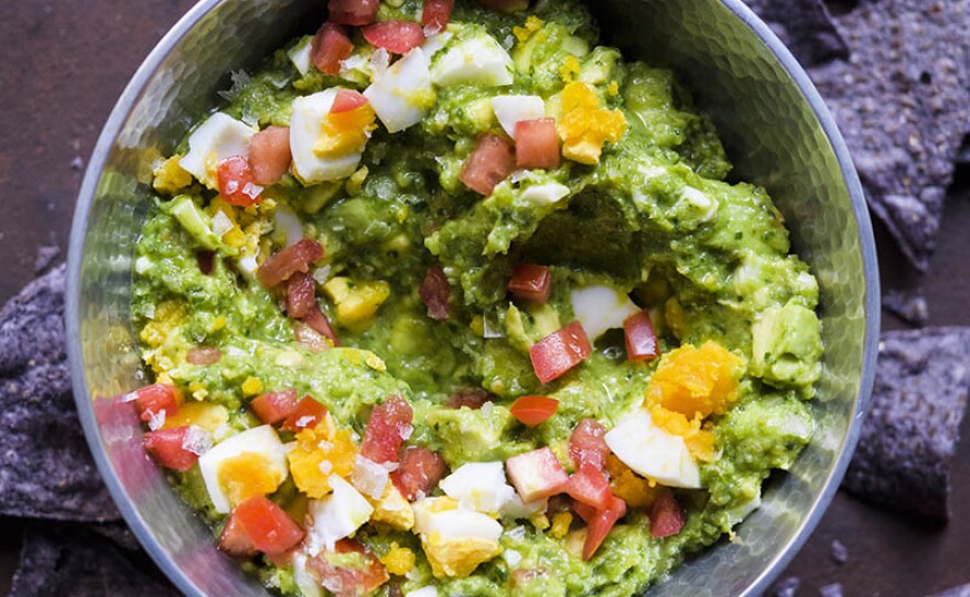 In this episode, the team peeks into the foods of South America, notably Colombia and Peru. Milk Street cook Josh Mamaclay breaks down the basics of creating a Colombian avocado salsa (ají de aguacate).