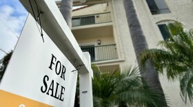 A for sale sign is posted outside a condo in the North Park neighborhood of San Diego on Feb. 27, 2024.