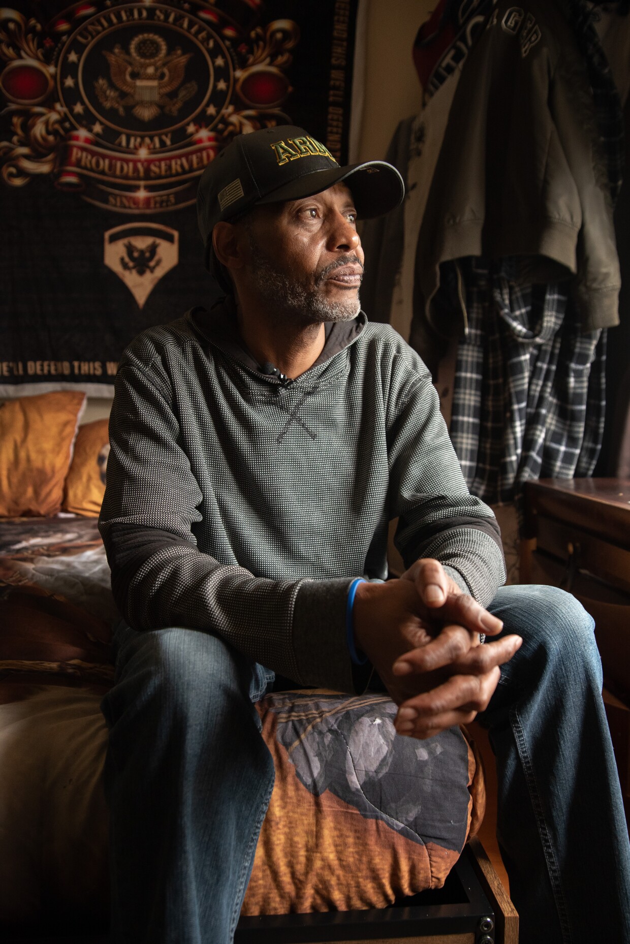 Calvin Neal looks out the window of his single-room occupancy on Friday, Oct. 3, 2025.