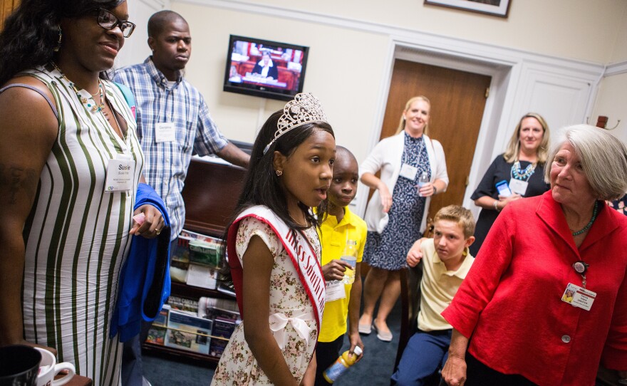 Tymia enters the office of South Carolina Rep. Mark Sanford, a Republican, as part of a lobbying trip organized by the Children's Hospital Association.