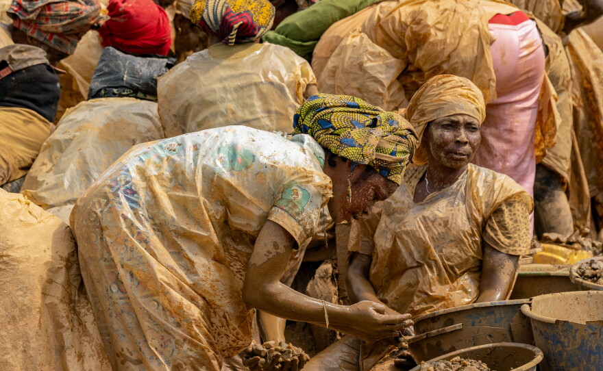 Women sift gold-bearing sediment in search of gold at the Maidede mine in the Democratic Republic of Congo's Ituri province on June 16.