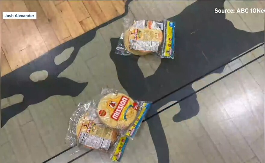 Tortillas are shown on the floor of the basketball court at Coronado High School following a game on June 19, 2021.