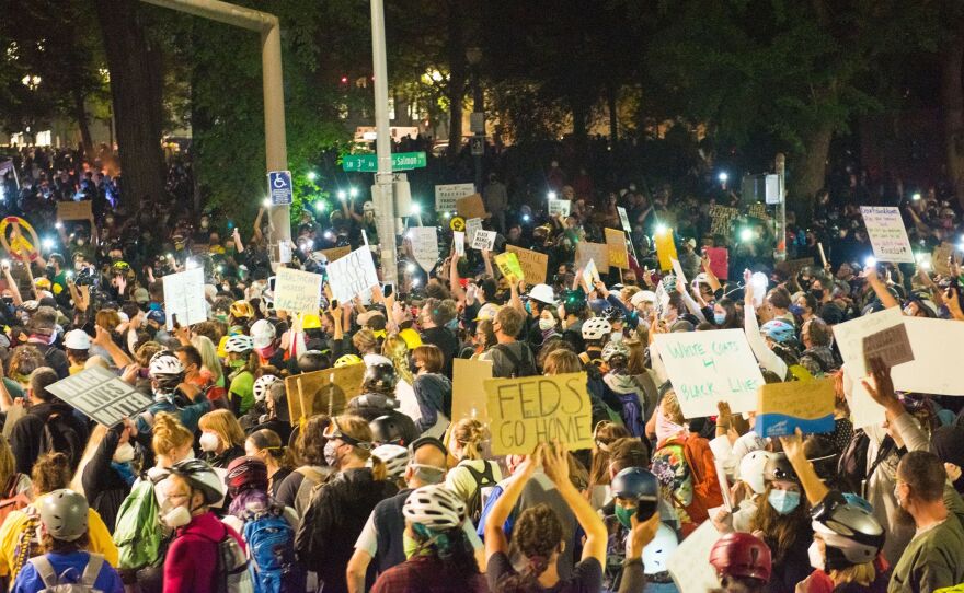 Protests in Portland, shown here on July 24, have grown increasingly heated with the presence of federal agents. On Monday, groups and individual protesters sued the federal government over its response.