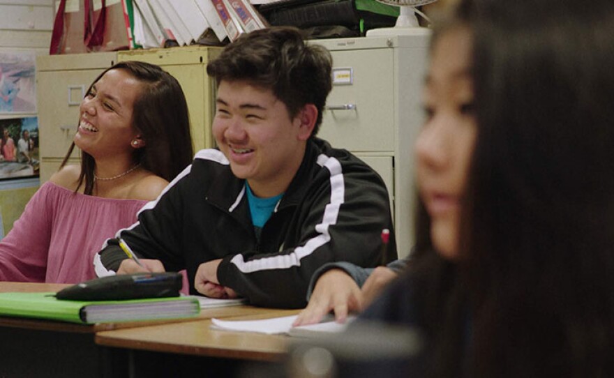 Jared and other students in a classroom. In preparation for the world's largest convening of high school scientists, teenage innovators from around the globe create cutting-edge solutions to confront environmental threats while navigating the doubts and insecurities of adolescence.