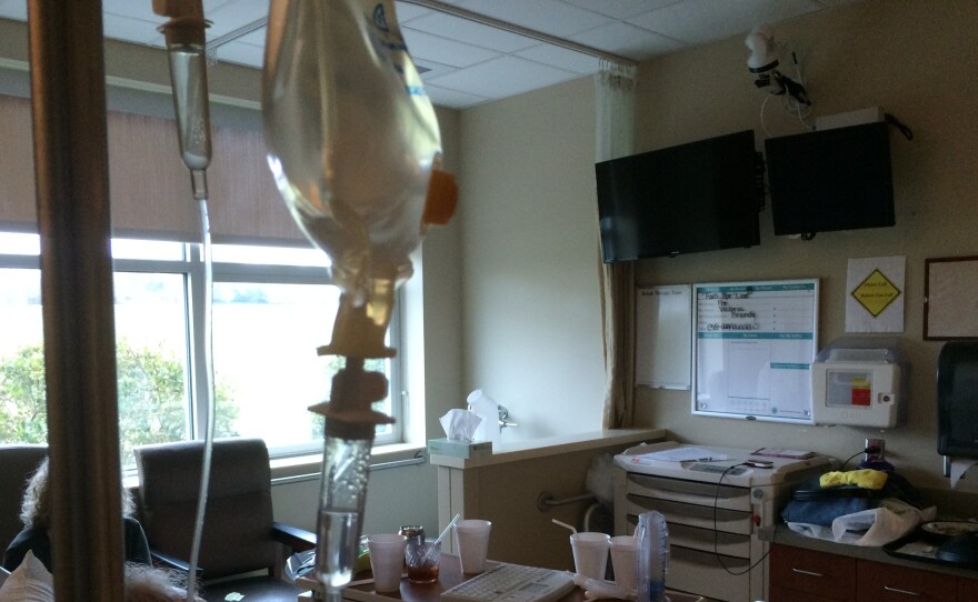 One of the screen's in Richard Gilbert's hospital room is a TV. The other is an eICU screen, that lets him see and converse with an extra nurse who checks on his care.