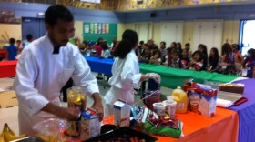 Local high school students help prepares the strawberry smoothies parents are sampled at Rice Elementary's first annual wellness fair in Chula Vista, May 18, 2012.