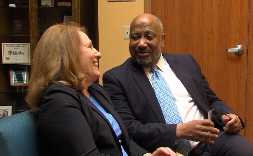 Valerie Jacobs and Reginald Jones talk outside Jones' office in the Jacobs Center, March 7, 2016.