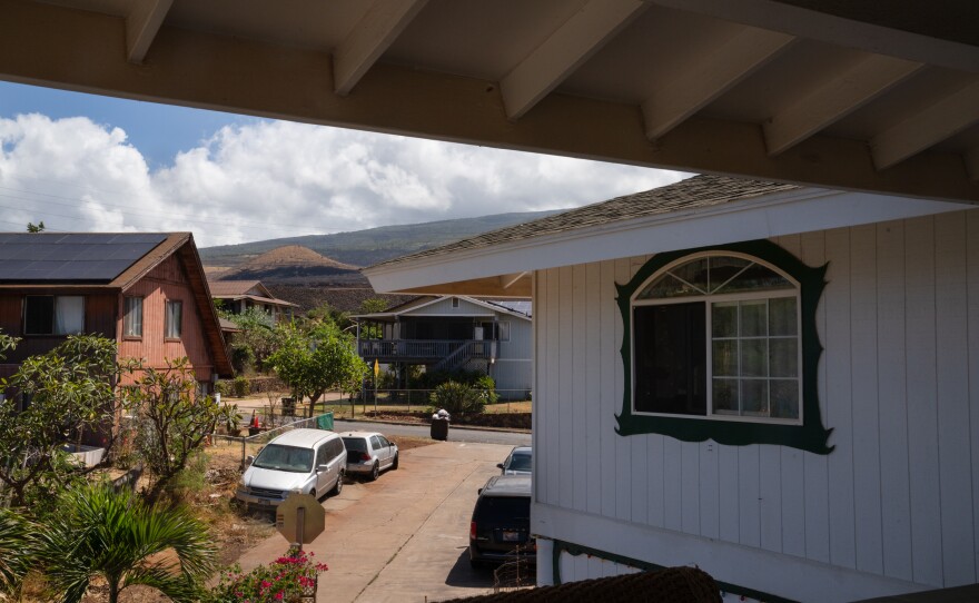 From Andres' deck burned patches of land can be seen in the distance.