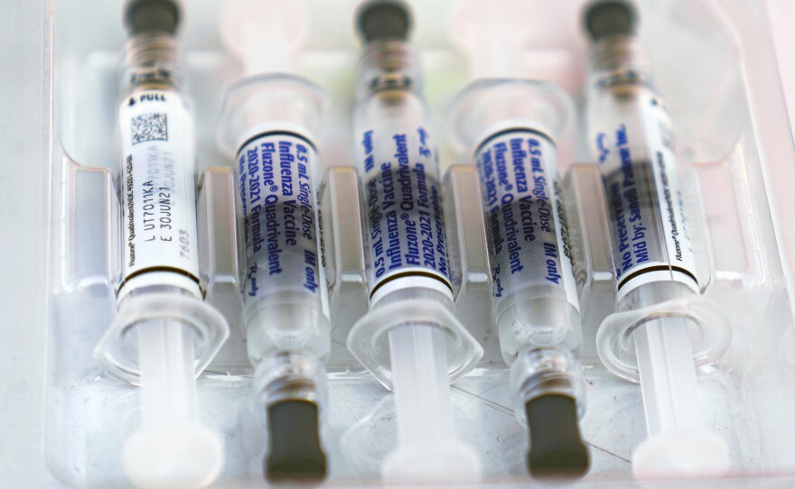 This Saturday, Oct. 17, 2020 file photo shows influenza vaccine syringes at the L.A. Care Health Plan and Blue Shield of California Promise Health Plan's Community Resource Center's Free Drive-Thru vaccination event in Los Angeles.