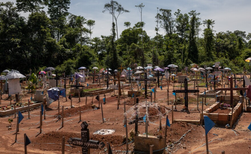 Community members added crosses and other markers to the locations where they were told people were buried in the mass grave in Iquitos. The mass grave was later renamed the COVID-19 Cemetery but many family members still want to exhume the bodies and move them to individual graves in the San Juan Bautiste Cemetery nearby.