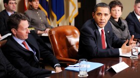 Flanked by Secretary of the Treasury Timothy Geithner (L) and senior advisor Valerie Jarrett, President Barack Obama speaks during a meeting with CEOs of several small and community banks December 22, 2009 in the Roosevelt Room at the White House in Washington, DC.