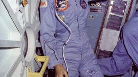Floating on the Middeck, Sally Ride floats alongside Challenger's middeck airlock hatch.

