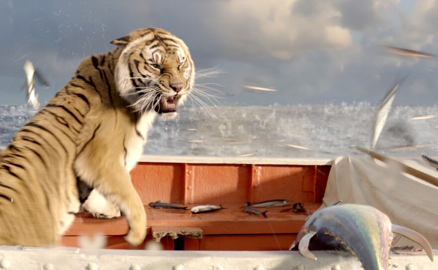 Richard Parker reacts to a school of flying fish.