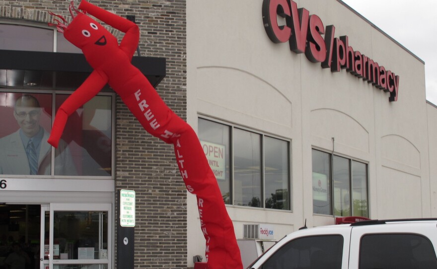 The group Enroll America sets up shop at a CVS in an East Houston neighborhood to talk to CVS customers about the federal health care law.