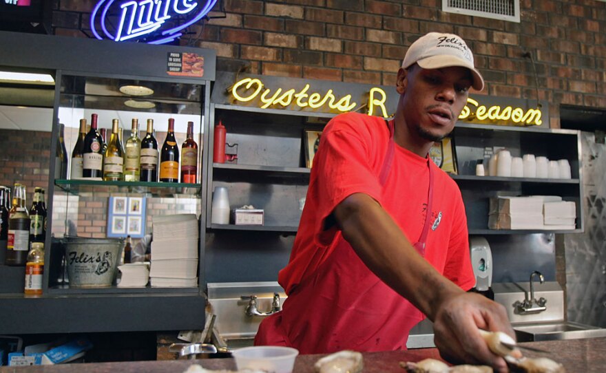 Kenneth Williams shucked oysters at Felix's Restaurant & Oyster Bar in New Orleans at the end of April. Restaurateurs say their seafood is safe and they won't put food on the table that isn't. But that hasn't stopped rumors from spreading.