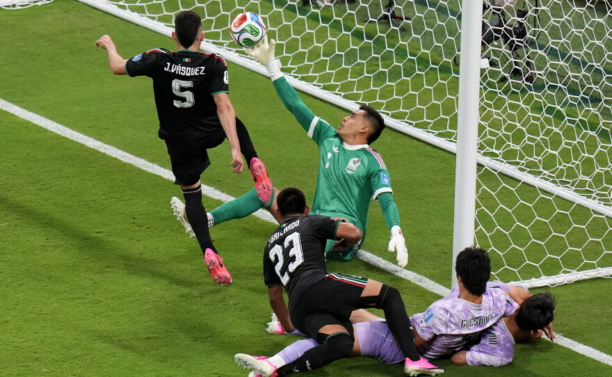 Mexico goalkeeper Raul Rangel, middle, reaches to stop the ball during the World Cup Group A soccer match between Mexico and South Korea in Zapopan, near Guadalajara, Mexico, Thursday, June 18, 2026.