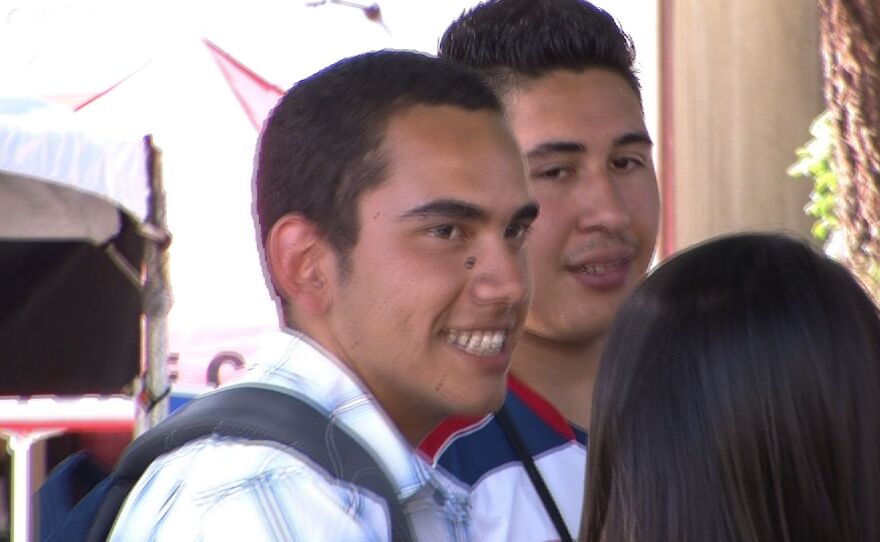 Christian Castro talks with friends outside the San Diego State Bookstore, August 29, 2011.