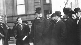 John Pierpont Morgan (center), surrounded by a group of men. (undated photo)