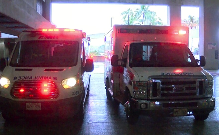 In this image taken from a video provided by Hawaii News Now, ambulances remain outside the international airport in Honolulu after multiple people were seriously injured when a flight to Hawaii hit severe turbulence  Sunday.