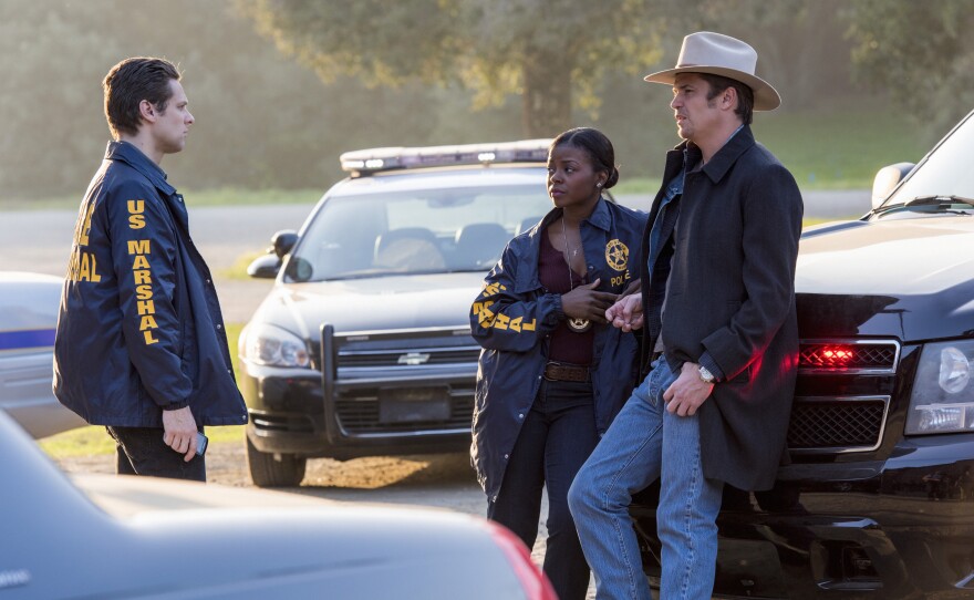 Deputy U.S. Marshal Tim Gutterson (Jacob Pitts), Deputy U.S. Marshal Rachel Brooks (Erica Tazel), and Deputy U.S. Marshal Raylan Givens (Timothy Olyphant).