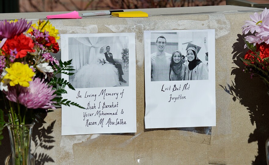 Flowers sit outside the University of North Carolina School of Dentistry in recognition of dentistry student Deah Shaddy Barakat, 23, his new wife Yusor Abu-Salha, 21, and her sister Razan Mohammad Abu-Salha, 19, February 11 in Chapel Hill, North Carolina. Deah and Yusor grew up together, and both attended Al-Iman School, an Islamic elementary and middle school in nearby Raleigh.