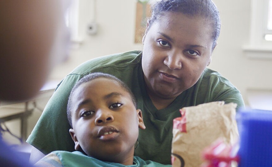 Dasan loves cuddling with his mom during Saturday visiting hours.
