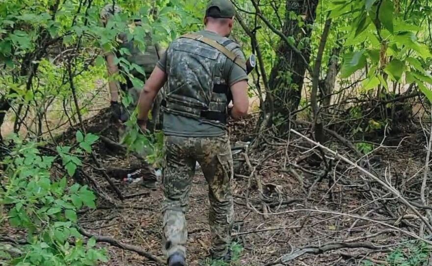 Ukrainian soldiers led NPR's team into the forest in the "gray zone" where they dug one of the defensive trenches used to stall Russia's advance.