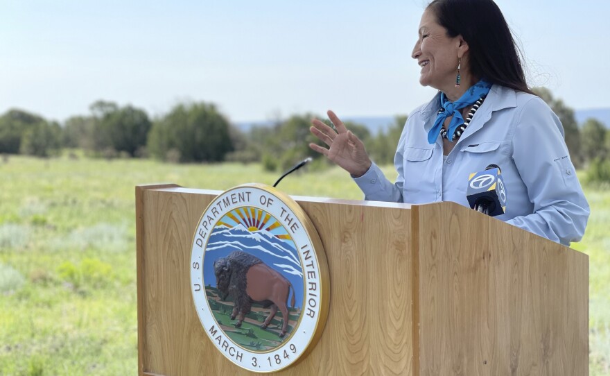 U.S. Interior Secretary Deb Haaland speaks at the Sabinoso Wilderness in Las Vegas, N.M., on July 17, 2021. The U.S. Department of the Interior has renamed five places in four states that had featured a racist term for a Native American woman.