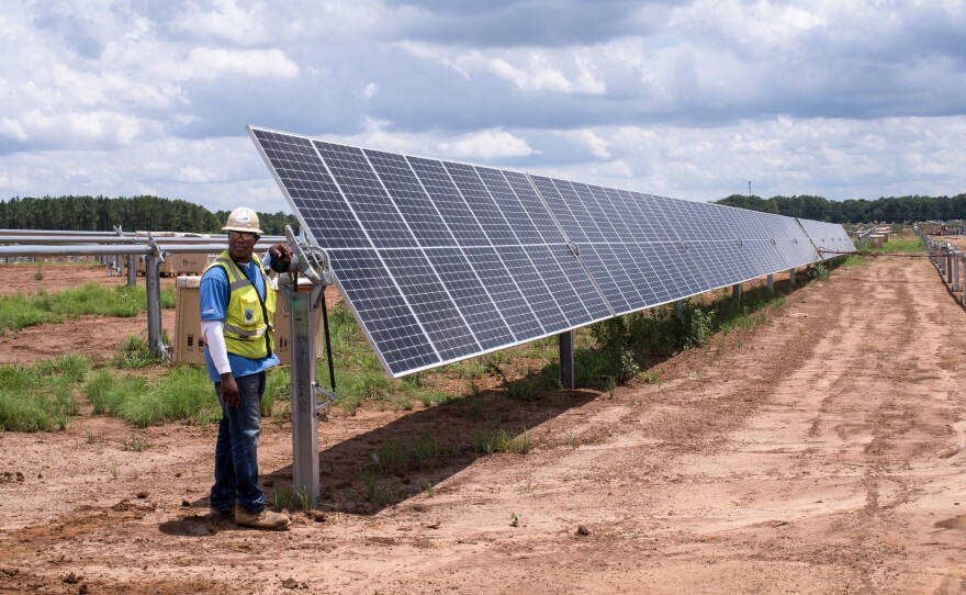 A row of solar panels is installed at Silicon Ranch's latest project outside Blakely, Ga. This 102.5-megawatt power plant will generate electricity for Facebook's new data center in Newton County, Ga., 200 miles away.