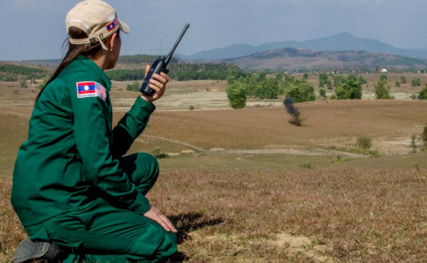 MAG's Provincial Operations Manager overseas a controlled demolition of cluster munitions or "bombies" found during MAG's UXO clearance operations in XK Province.