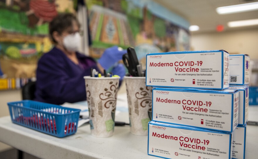 A nurse prepares a dose of the Moderna COVID vaccine at a San Antonio senior center in March. A panel of advisers to the Food and Drug Administration will meet Thursday to review Moderna's booster shot.
