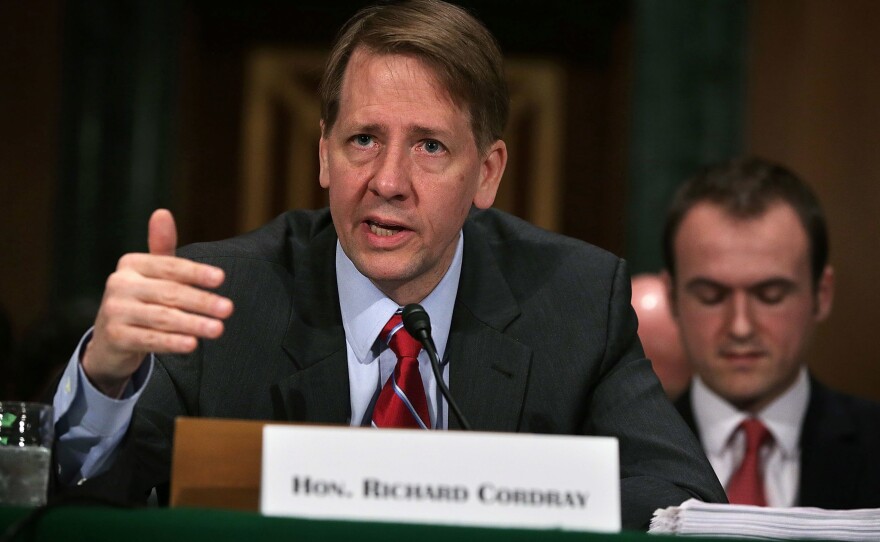 Richard Cordray, director of the Consumer Financial Protection Bureau, testifies before a Senate committee last year. The Trump administration is trying to bring the independent bureau under the president's direct control.