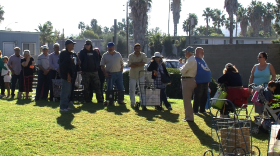People line up for canned foods at the Salvation Army in El Cajon, October 22, 2014.