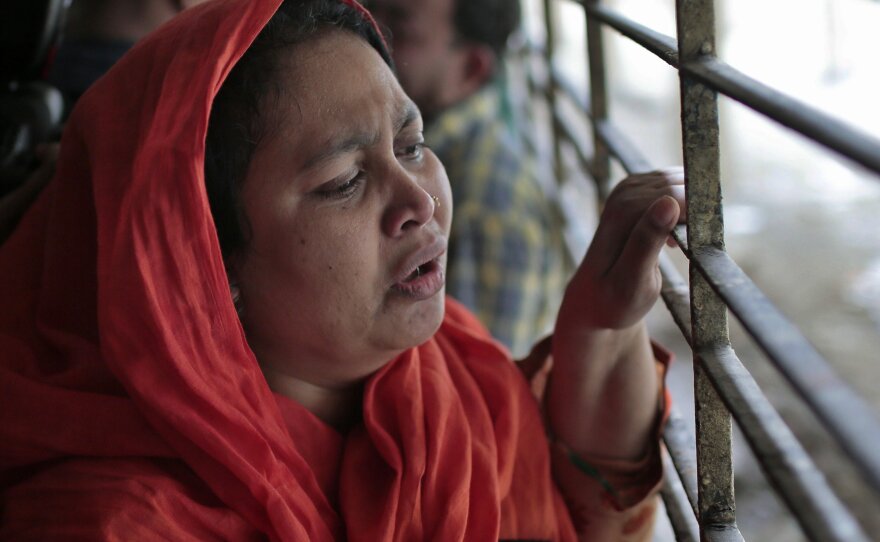Shilpi, a cousin of Bangladeshi blogger Washiqur Rahman, is seen outside a morgue at the Dhaka Medical College in Dhaka, Bangladesh, on Monday. The blogger was hacked to death this morning by three men in the capital, police said.