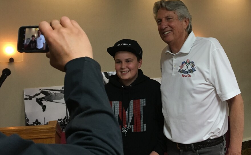 Former Olympic high jump champion Dick Fosbury posed with Cooper Cox of Medford, Ore. during a book signing appearance in 2018. Fosbury, who grew up in Medford, won the high jump gold medal at the 1968 Mexico City Olympics and set an Olympic and U.S. record at the time.