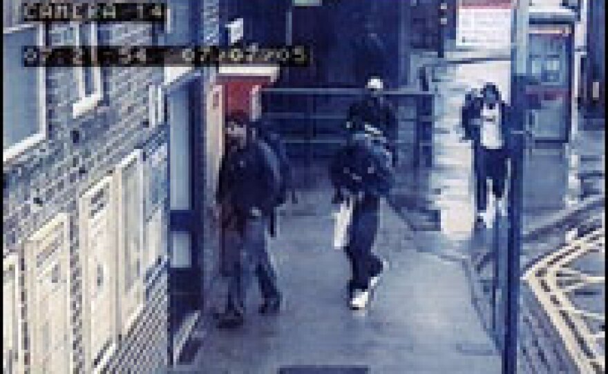 Image released by Scotland Yard shows bombing suspects entering rail station.