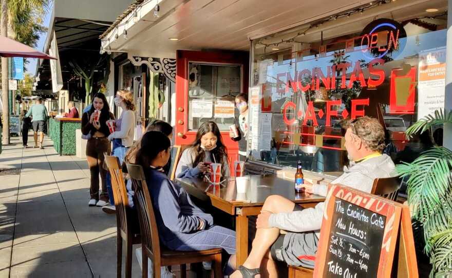 Patrons dining in front of Encinitas Cafe on Jan. 3, 2021, which was opened in violation of the regional stay-at-home order.
