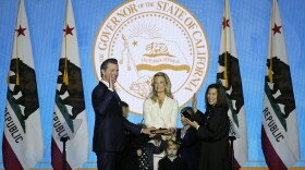 California Governor Gavin Newsom takes the oath of office from state Supreme Court Chief Justice Tani Gorre Cantil-Sakauye as his wife Jennifer Siebel Newsom and children look on during his inauguration Monday, Jan. 7, 2019. 